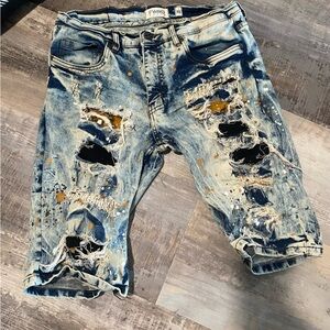FWRD Distressed Blue Denim Shorts with paint splatters
